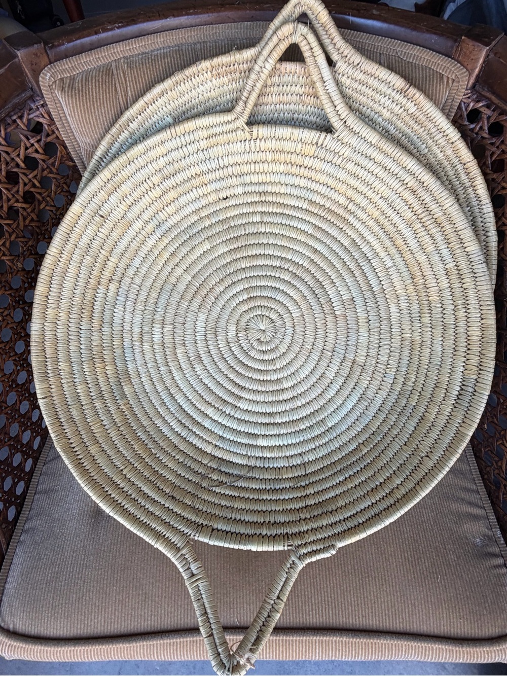 THREE Seagrass woven round handle baskets